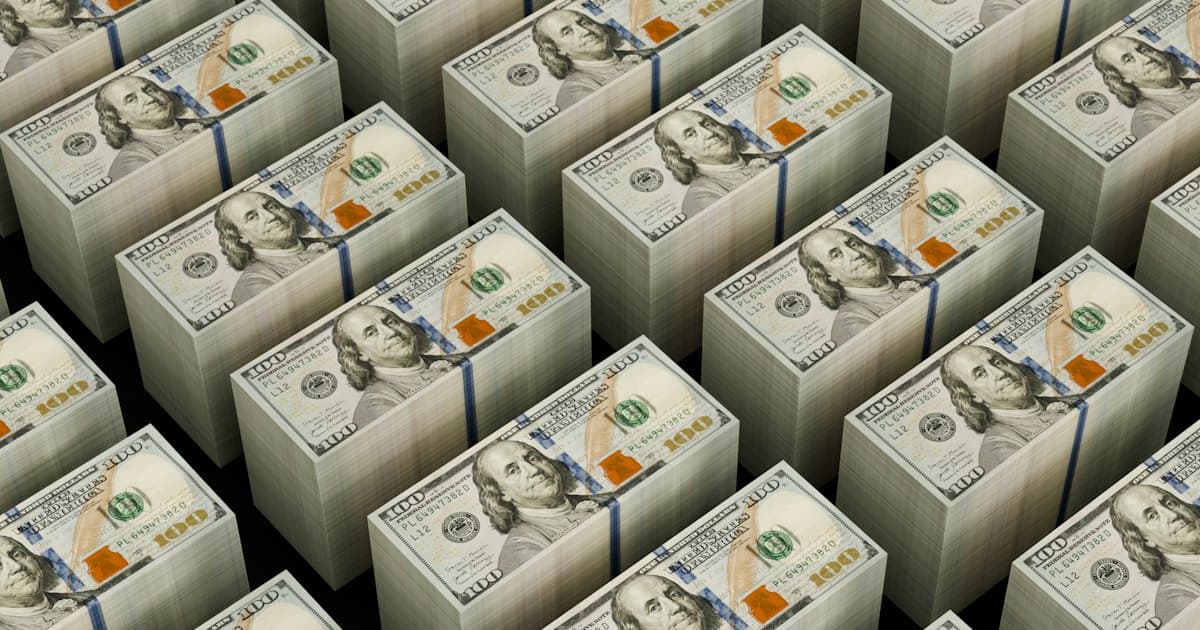 Rows of banded stacks of hundred dollar bills stretching into the distance.